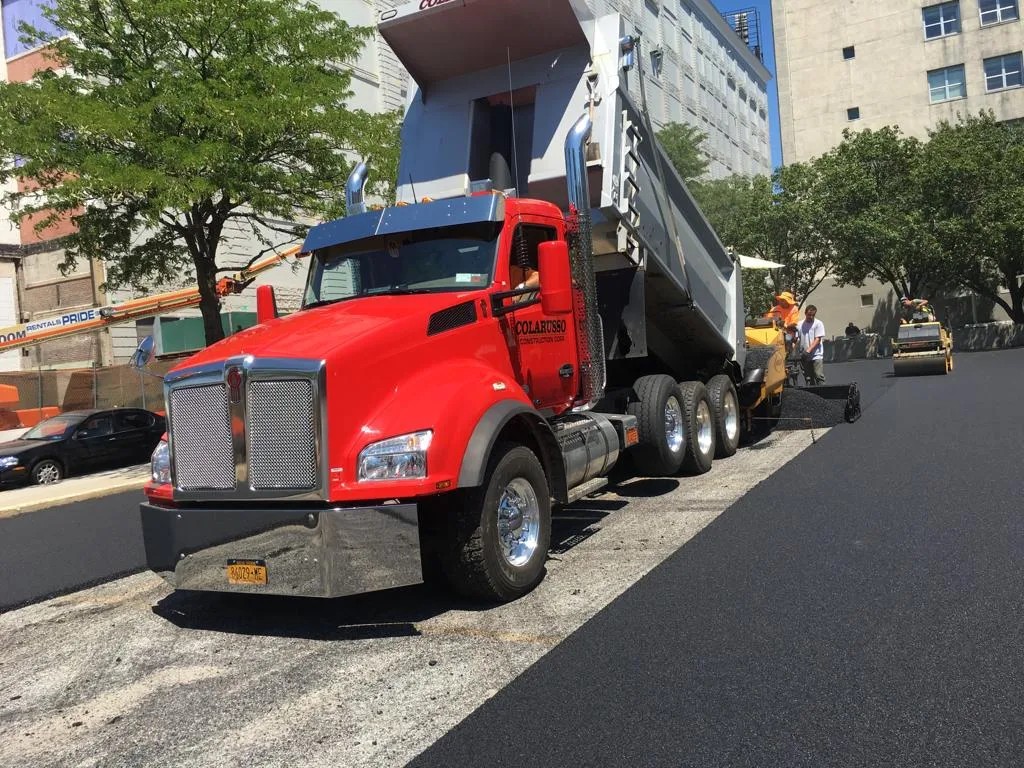 Asphalt base preparation and compaction in College Point, Queens — Grey Ruso construction project